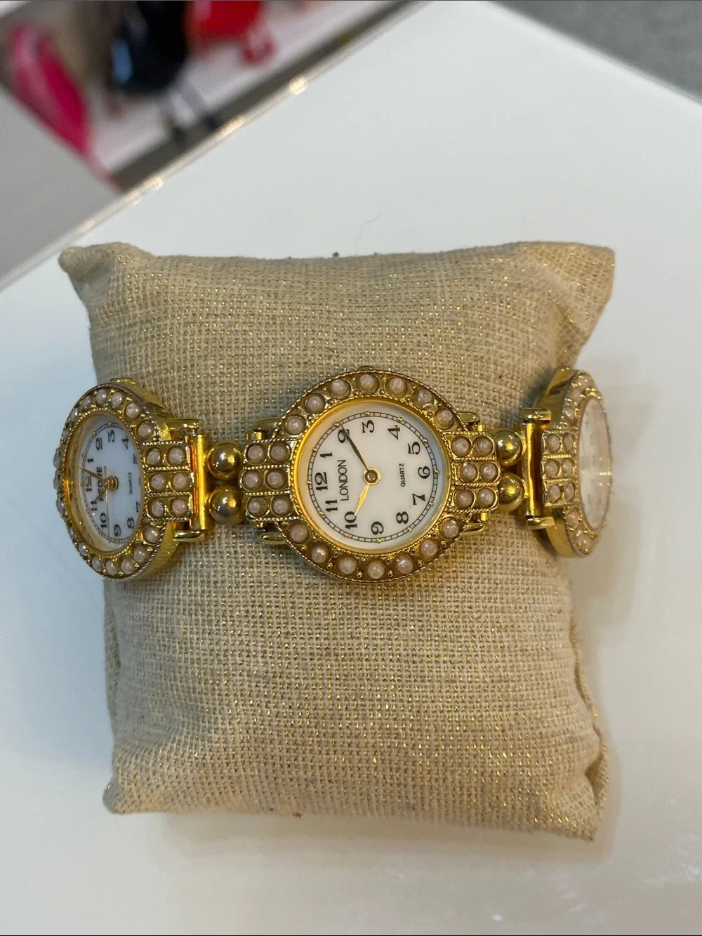 Faux pearl gold tone watch